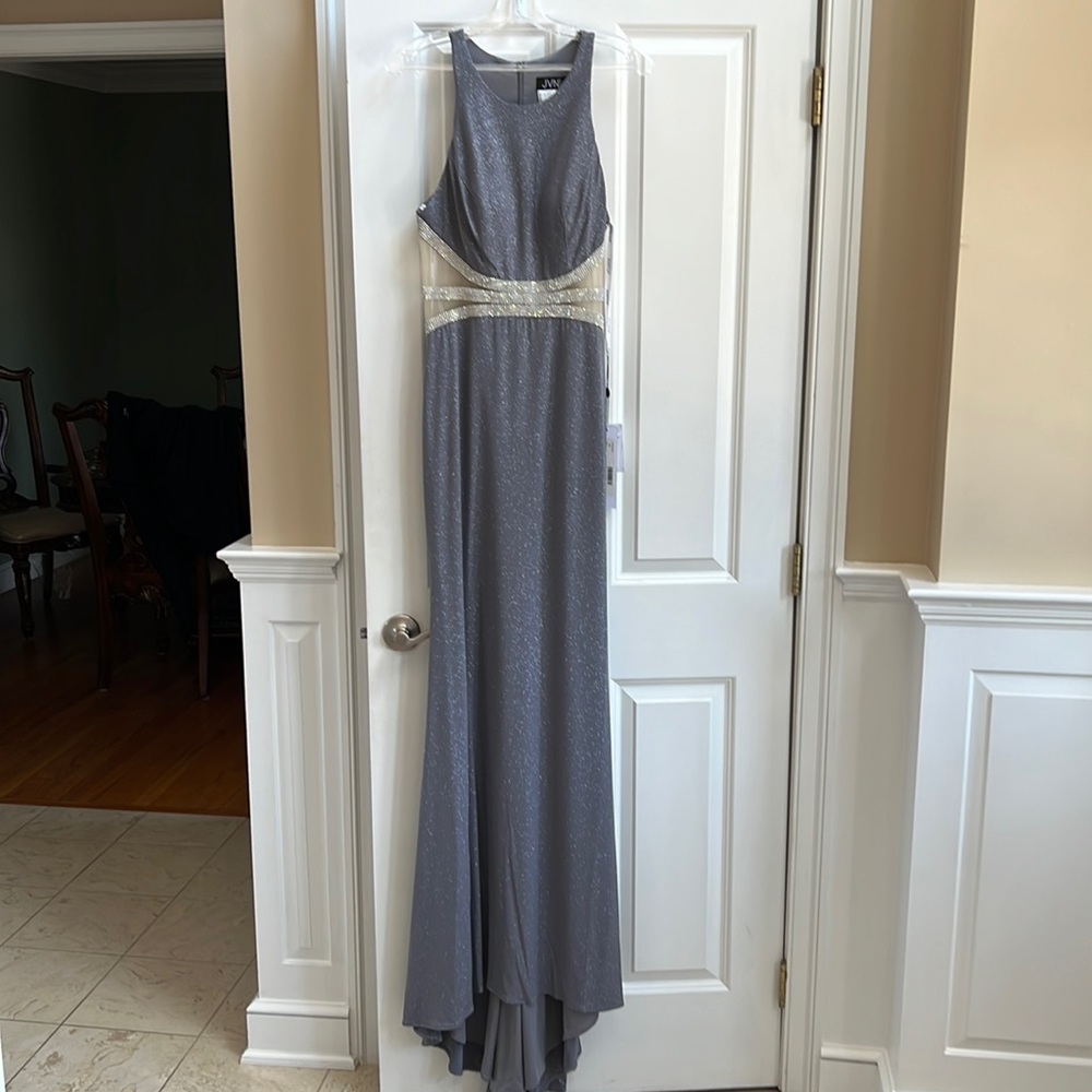 Long glittery gown. Sleeveless racer back style with beaded waistline
